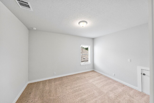 Building Photo - Greenbelt. 3 Car Garage. Built In Dog Room.