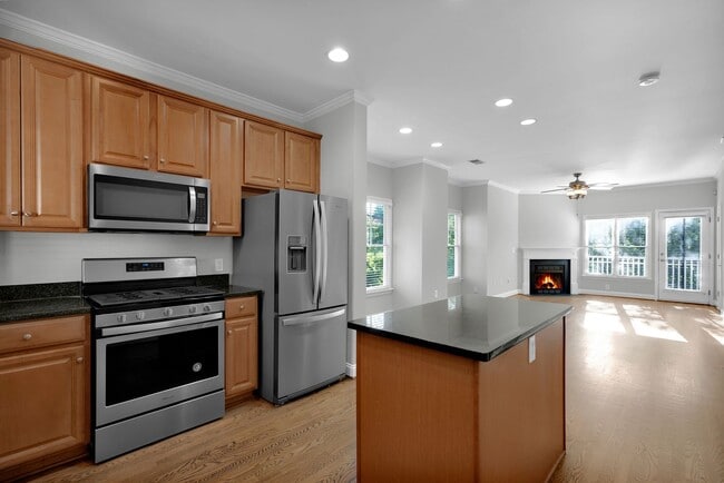 Building Photo - Wonderful craftsman style end-unit townhome