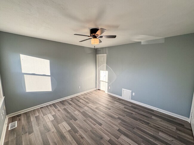 Building Photo - Introducing our spacious townhouse located...