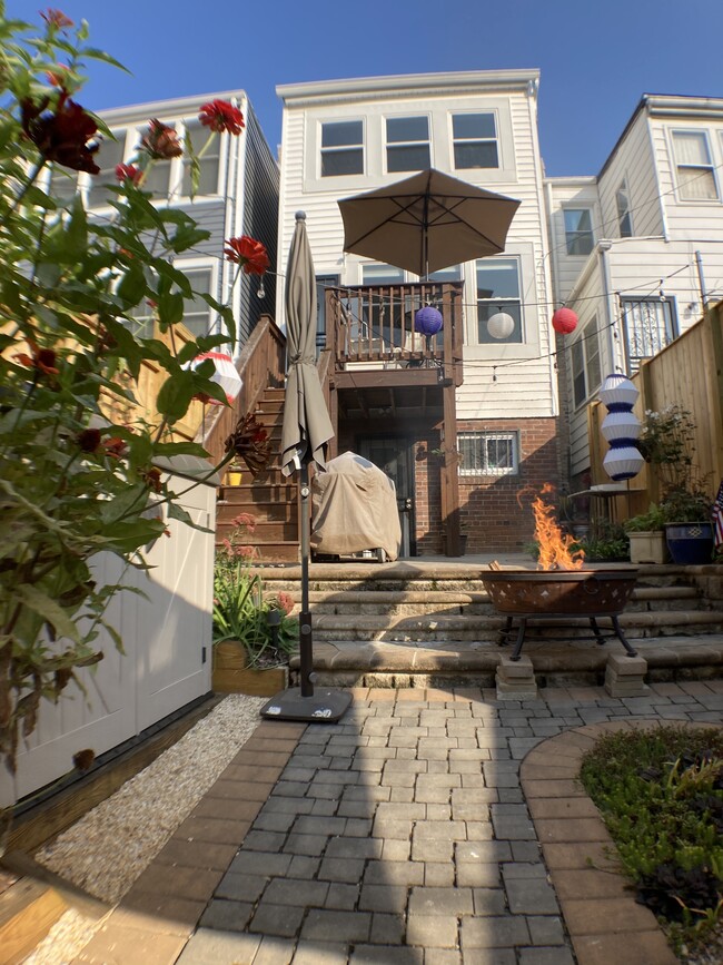 Enjoy the back patio and firepit. - 526 24th St NE