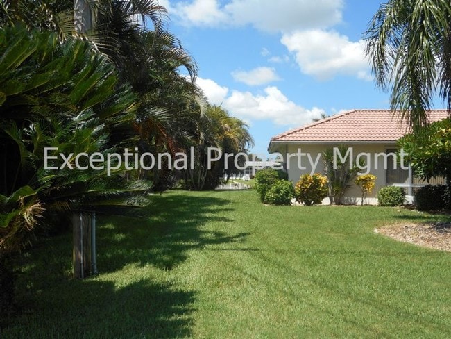 Building Photo - Spacious Home with Luxurious Primary Suite + Den on Oversized Gulf Access Lot!