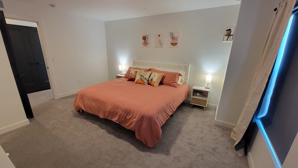 Primary bedroom with a king bed. - 1739 S Main St