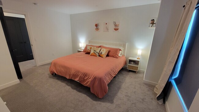 Primary bedroom with a king bed. - 1739 S Main St