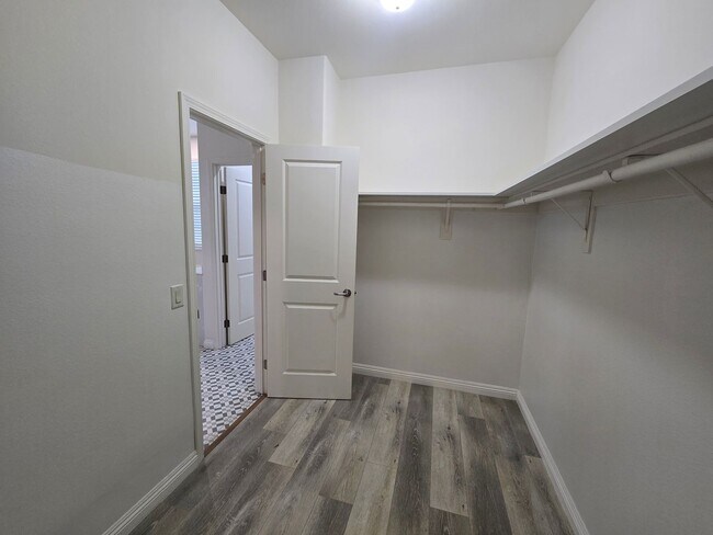 Building Photo - Open-Concept Living with Downstairs Bedroom & Enclosed Patio Retreat