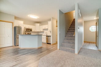 Welcome to Cascade Pines, where spacious townhomes feature modern kitchens, open layouts, and refined finishes. - Cascade Pines Duplexes
