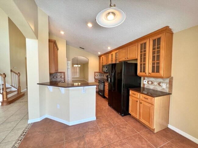 Building Photo - EAGLE CREEK LAKE NONA! WELCOME HOME! Beautiful water views! Spacious 2 story-3 bedroom 2.5 bath h...