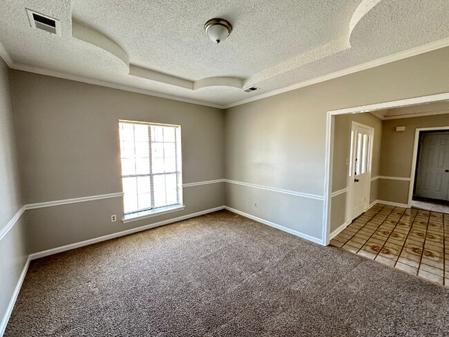 Building Photo - Grand 4BR/2BA Near Southwind | 2,438 Sq Ft, Stone Fireplace, Soaking Tub & 2-Car Garage
