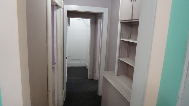 Walk in closet and bookshelves in hallway - 1307 SW Mulvane St