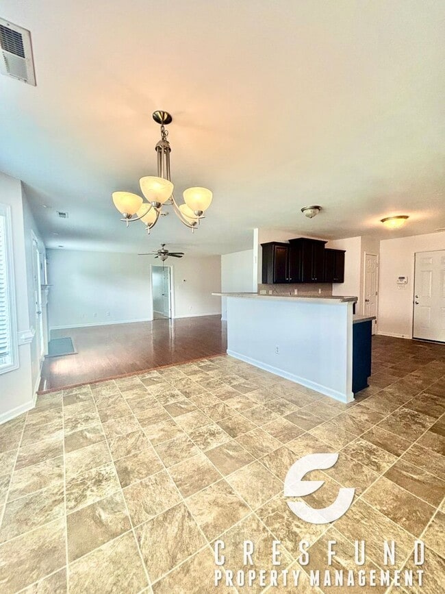 Building Photo - Freshly Painted and Spacious 4 Bedroom, 3 ...