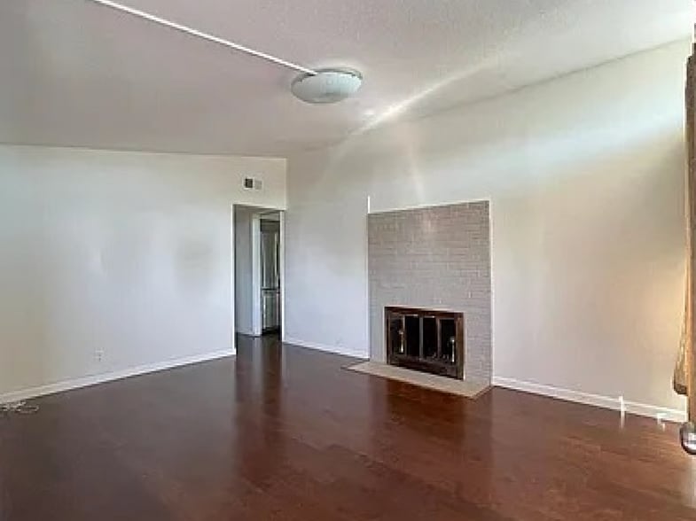 Hall with fire place and decorative lighting - 27596 La Porte Ave