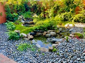 The cascades of the backyard are a pleasant way to relax while dining or otherwise. - 11449 Woodbine St