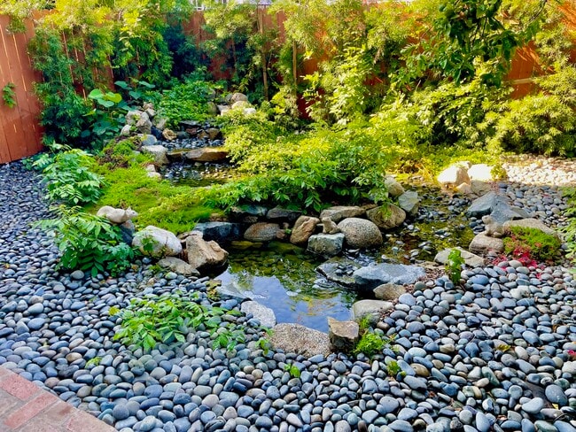 The cascades of the backyard are a pleasant way to relax while dining or otherwise. - 11449 Woodbine St