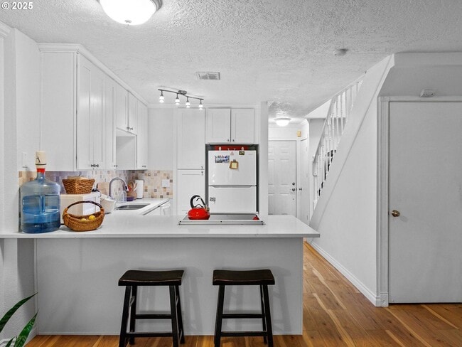 Building Photo - Bright & Inviting 2-Bed, 1.5-Bath with Modern Touches and Private Upstairs Retreat