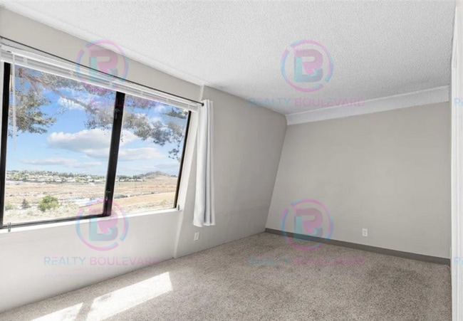Building Photo - Incredible condo near UNR! This charming 2...