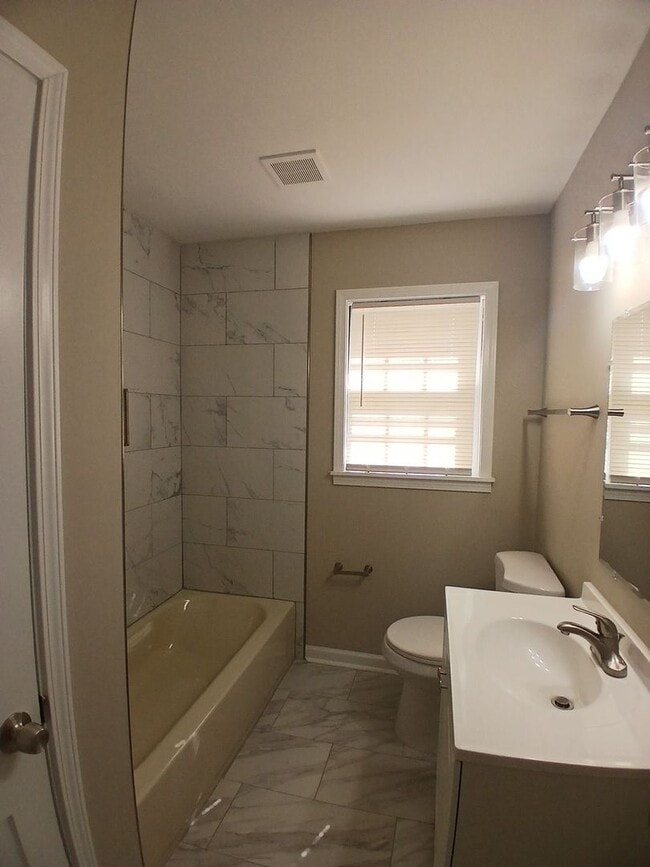 Building Photo - Stunning Renovation with Classic Character and Modern Upgrades