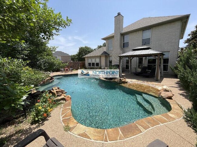 Building Photo - Stunning corner lot home with beautiful pool and upgrades throughout.