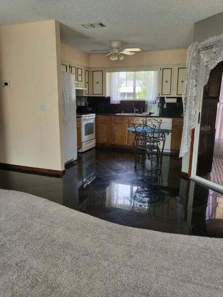 Kitchen granite floors glass stove dishwasher - 10871 SW 90th Ct