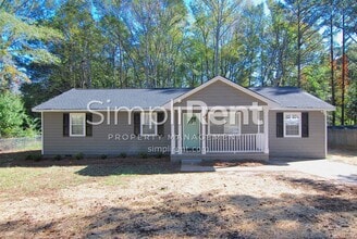 Building Photo - JUST REDUCED! 4 Bdrm / 2 Bath Home - 1st m...