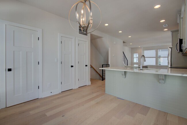 Building Photo - COMING SOON! Modern End-Unit Living Near Uptown | Rooftop Terrace + Tandem Garage