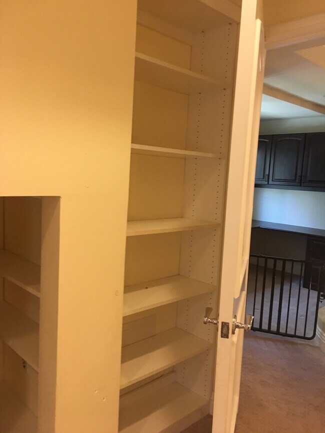 Upstairs bedroom wit lots of storage - 1540 S Bentley Ave