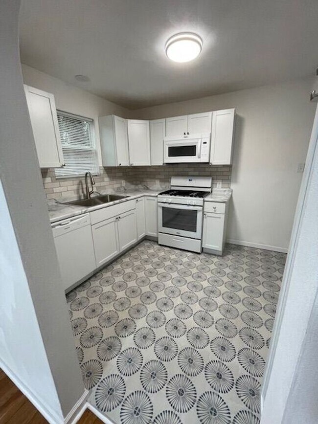 Building Photo - Charming 2-bedroom home, fully renovated and sharing 8 acres