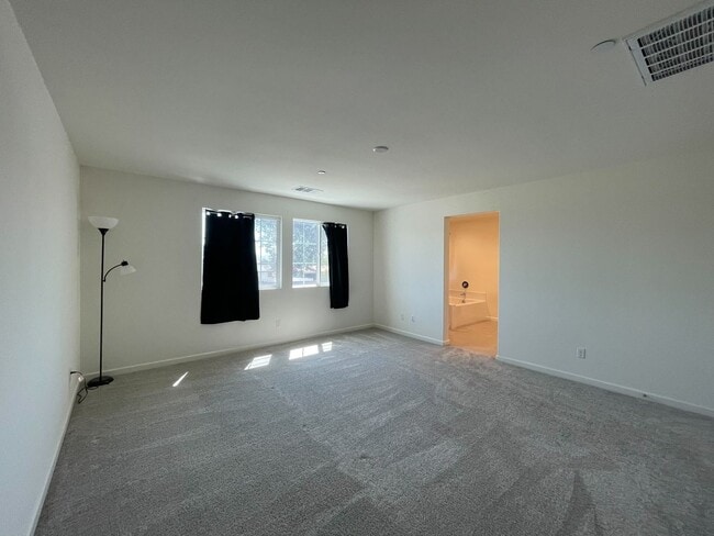 Building Photo - 5-Bedroom Home with In-Law Suite in Gated ...