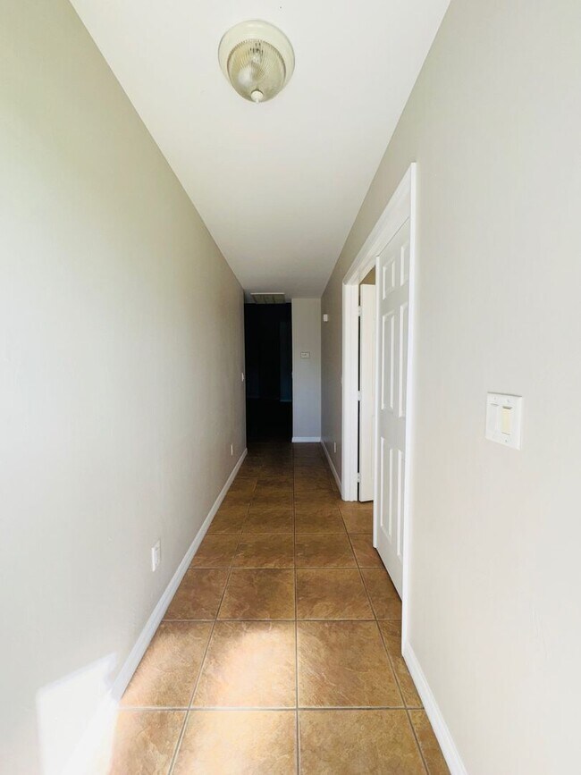 Building Photo - Experience this Cape Coral 3 bedroom 2 bath corner duplex with 1 car garage and screened in lanai.