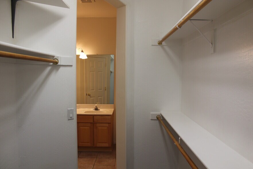 Walk in closet master looking to bathroom - 440 S Val Vista Dr.