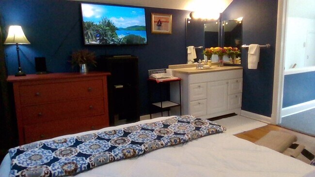 View of Dresser, Smart TV & sink - 102 W College St