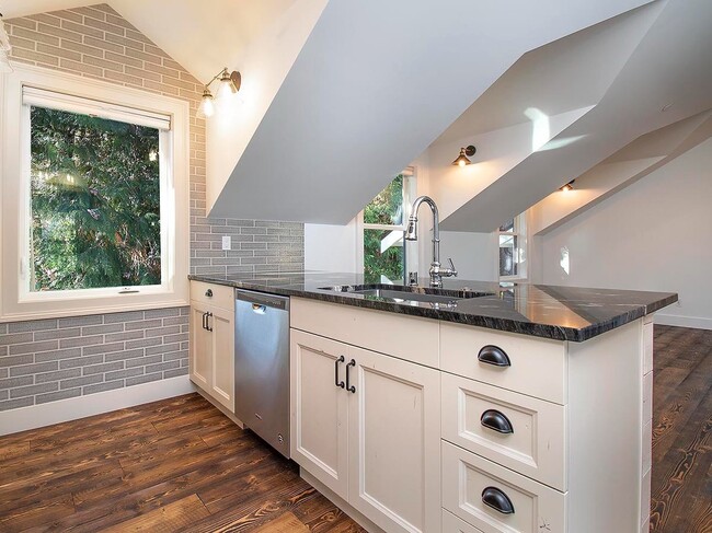 Building Photo - Expansive Loft-Style Carriage House in Private Haller Lake Estate