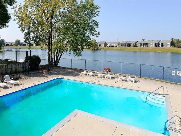 Community pool steps from this unit. - 7695 Harbour Is
