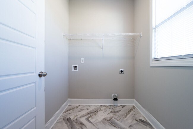 Building Photo - Elegant Home with Stone Fireplace, Kitchen Island and Designer Primary Suite