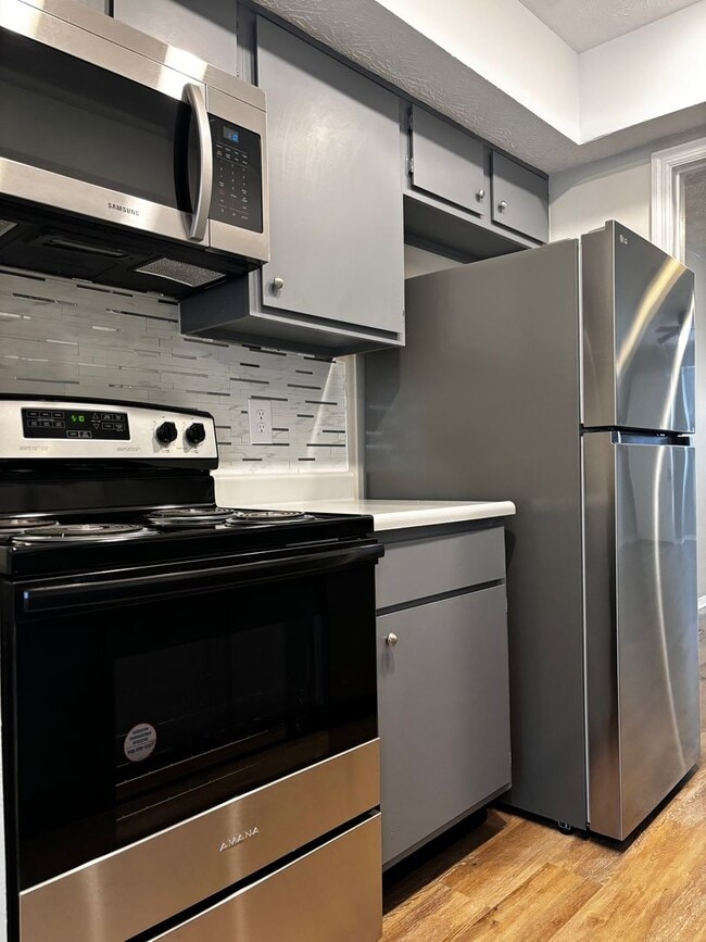 Building Photo - Charming 2-Bed, 1.5-Bath Condo with Carpor...