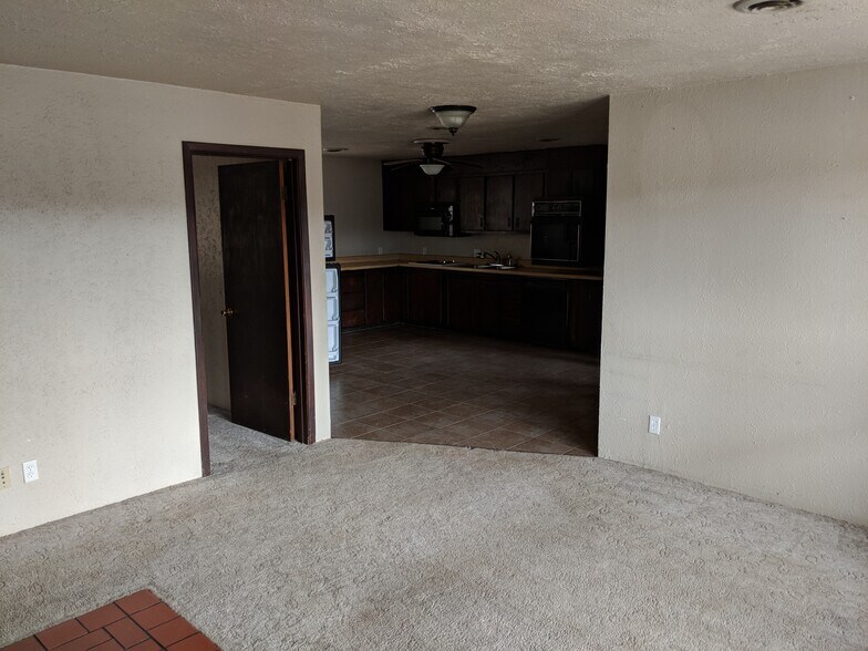Living Room. We are replacing the carpet with premium LVP. - 5235 Highway NN