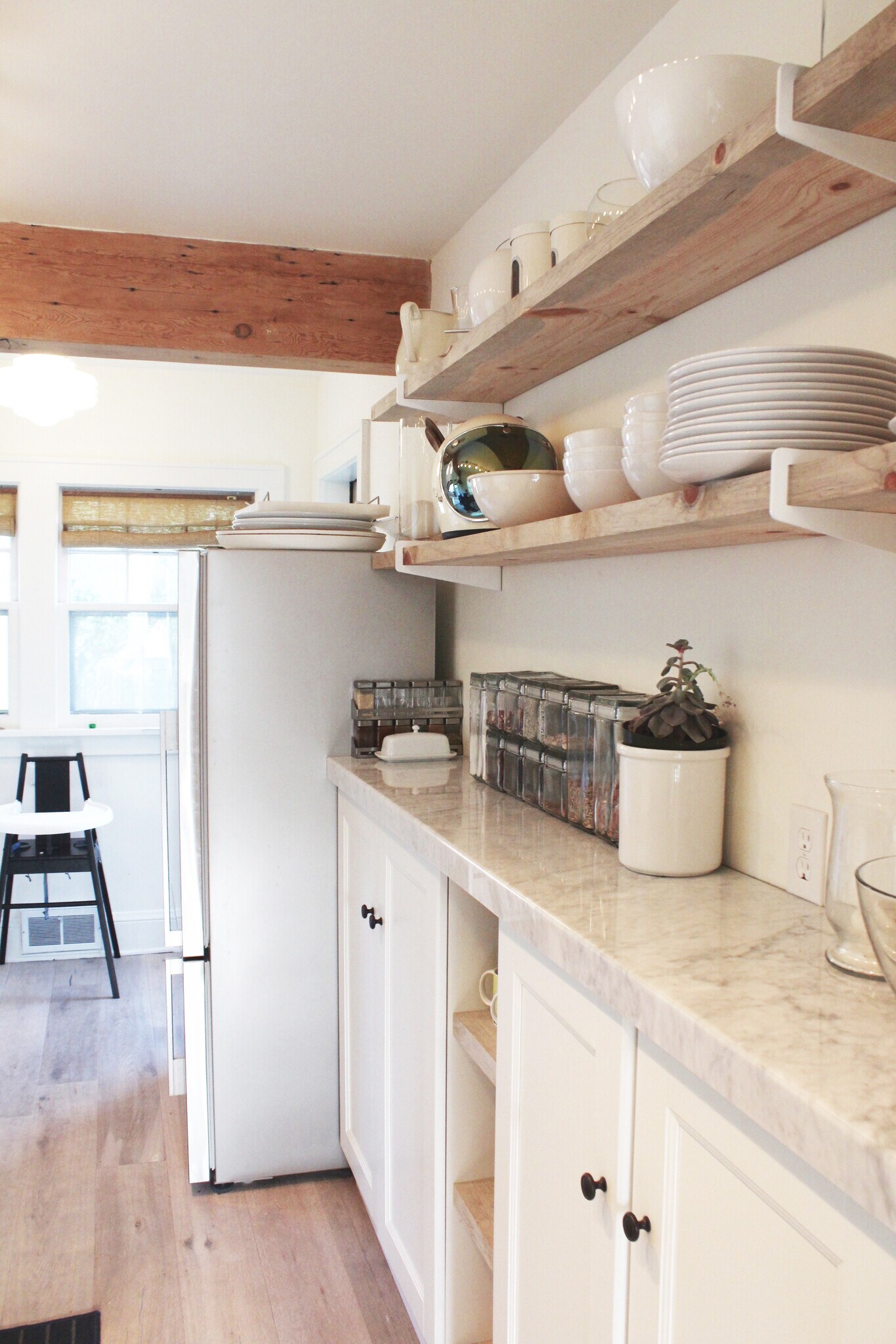 Open and closed shelving atop real Carrera Marble. - 2635 NE 30th Ave