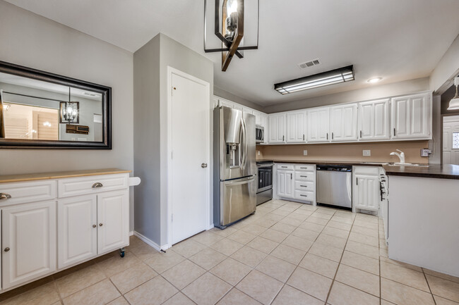 Kitchen with pantry and plenty of cabinet and counter space. - 613 Pace Dr