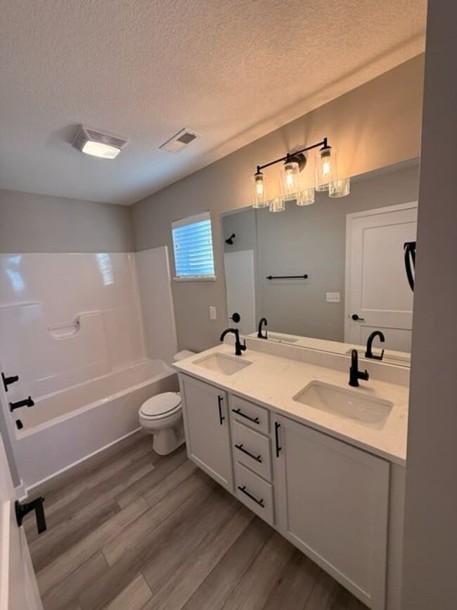 Building Photo - Spacious 4-Bedroom Home with 2-Car Garage & Yard