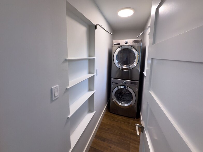 Laundry closet with stacked washer/dryer and shelf storage - 2006 Candle Ct