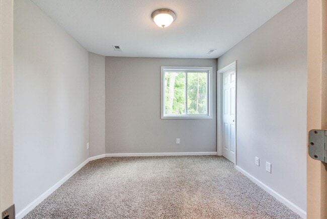 Building Photo - Two Story Duplex With Hardwood Flooring and White Cabinetry