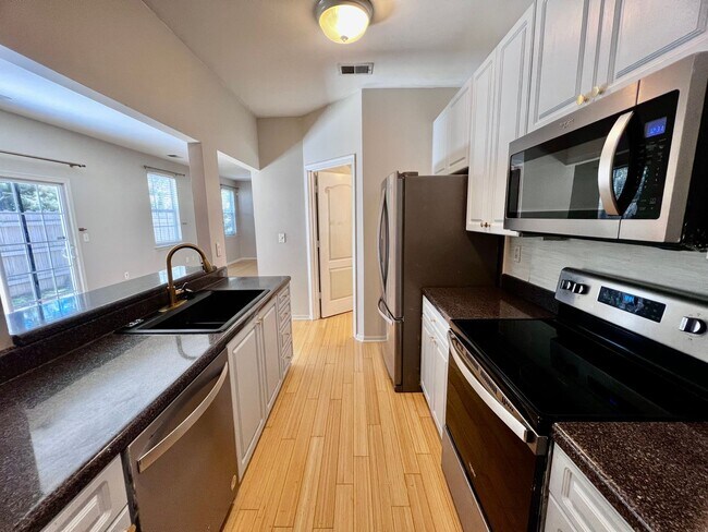 Building Photo - Beautifully Remodeled Corner Condo with Dual Primary Suites in The Villas at Bellamy