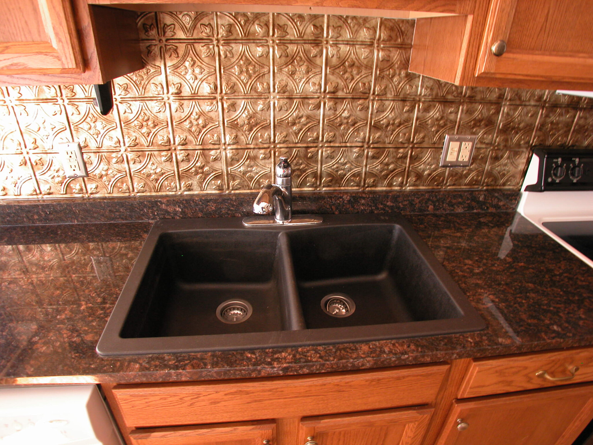 Granite Sink, pressed tin backsplash - 218 Ontario St