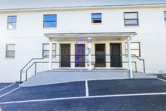 Building Photo - Move in before December 31st and choose your reward: a $250 Amazon Gift Card or a 55" Smart TV!