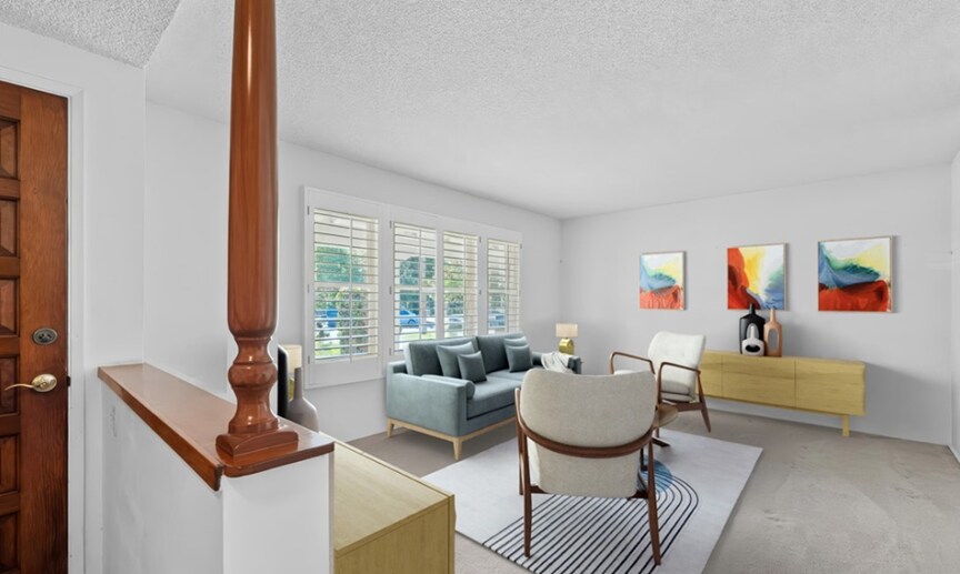 Freshly painted living room with plantation shutters - 1419 S 4th Ave