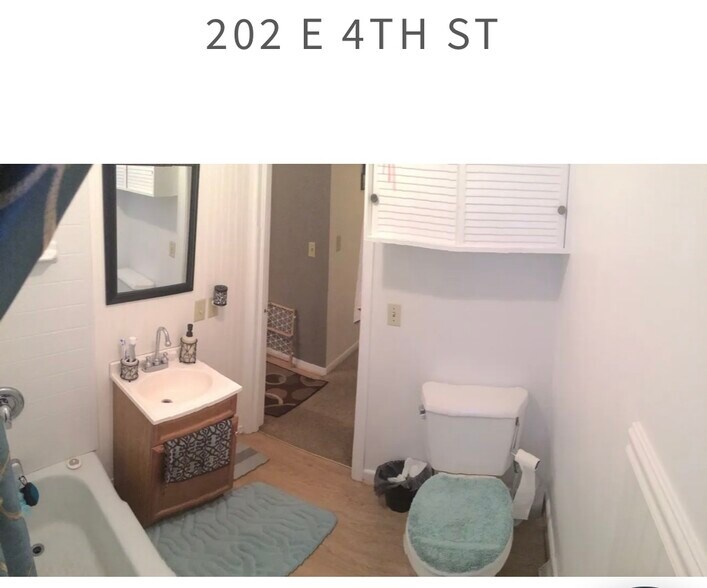 202 bathroom with tub and shower - 204 E 4th St