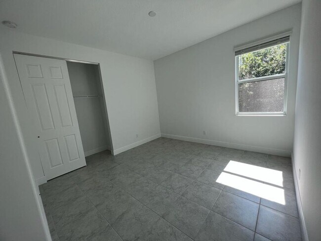 Building Photo - This Charming Brand-New Home is a 4/3 with...