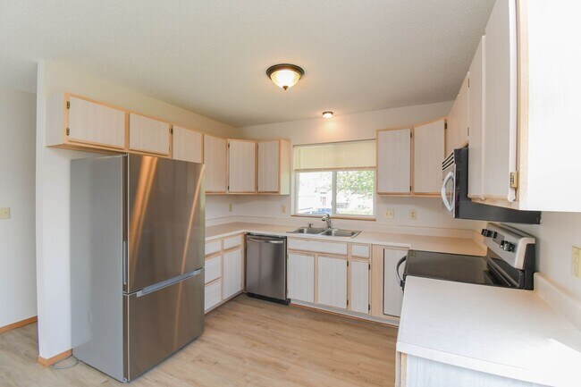 Building Photo - Updated 3BR Split-Level Home with Huge Deck, Fenced Yard & 2-Car Garage Near I-29!