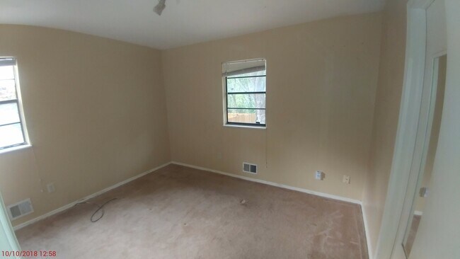 Building Photo - Three bedroom with office and family room ...