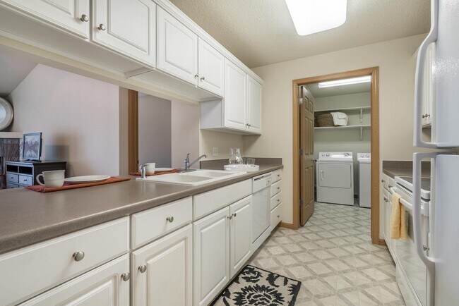 You'll love our thoughtfully designed kitchens with ample cabinetry and counter space. - Pinebrook Apartments