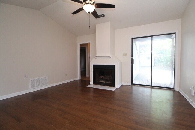 Building Photo - 2BR Home with Wood-Look Flooring, Fenced Backyard & Private Patio