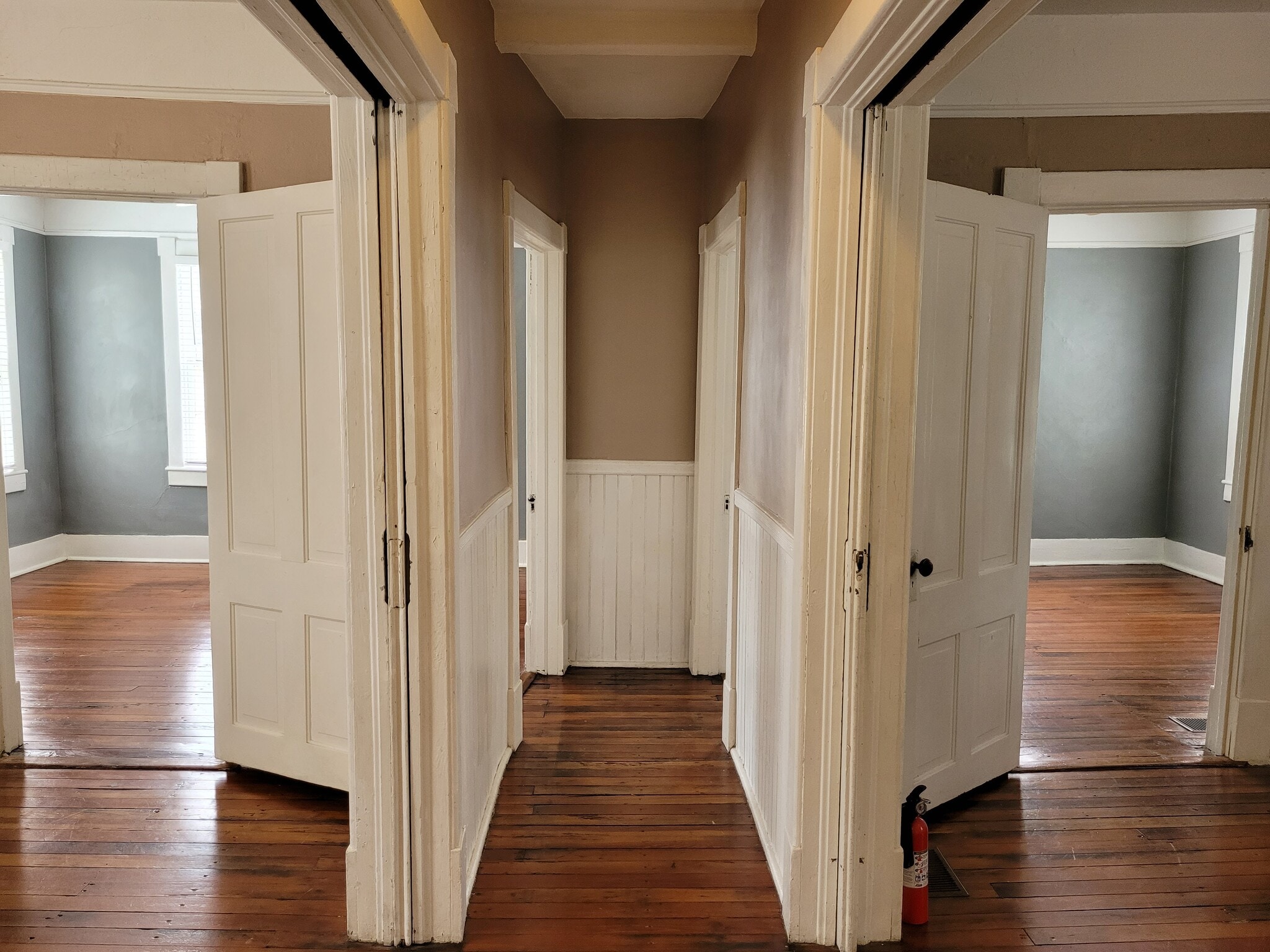 Central Hall - Living & Dining divided by double pocket doors. Bedrooms ahead through doors. - 1215 Java Pl